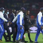 Security escourt Ethiopian referee Bamlak Tessema Weyesa (3rd R) off the field during the Africa Cup of Nations (CAN) 2021 round of 16 football match between Cameroon and Comoros at Stade d'Olembe in Yaounde on January 24, 2022. (Photo by Kenzo Tribouillard / AFP)